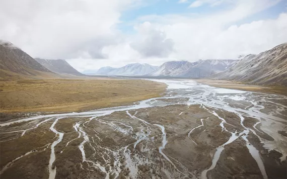 A shallow river with many tributaries runs through the Arctic National Wildlife Refuge