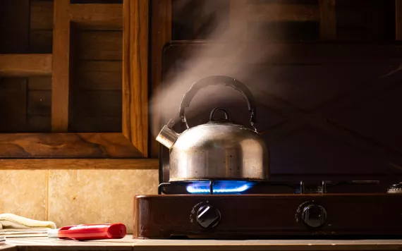 tea kettle on a gas stove