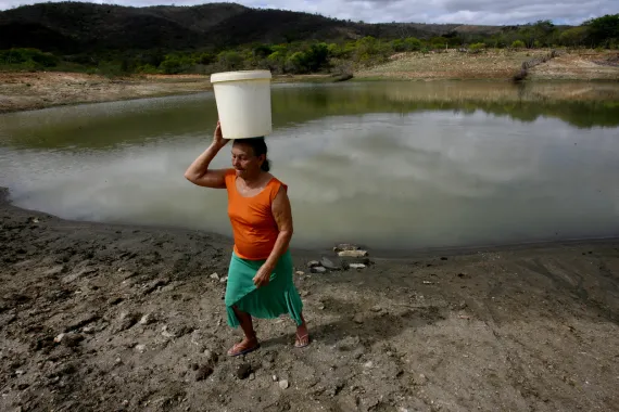 woman carrying water