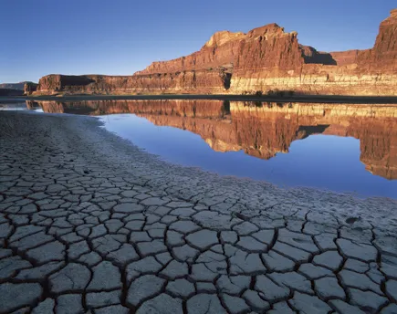 Morning light illuminates cliffs across from Lake Powell’s abandoned Hite Marina boat ramp. 