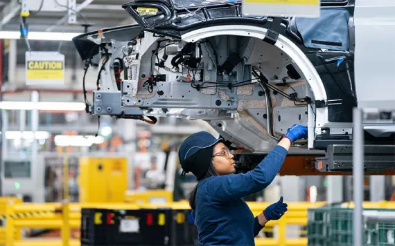 An employee works in the X3 X4 assembly hall at the BMW Spartanburg plant in Greer, S.C. 