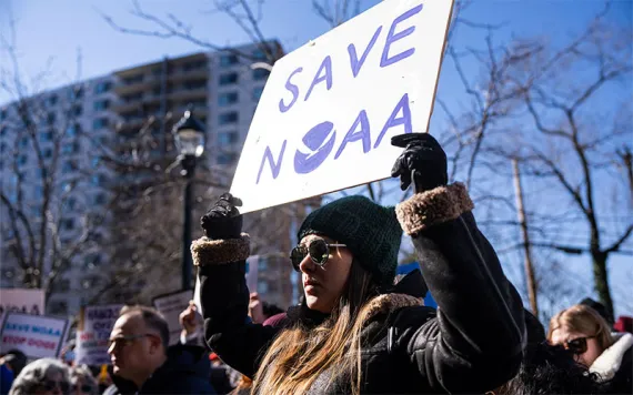 Demonstrators attend rally outside National Oceanic and Atmospheric Administration headquarters to oppose the recent worker firings, in Silver Spring, Maryland.