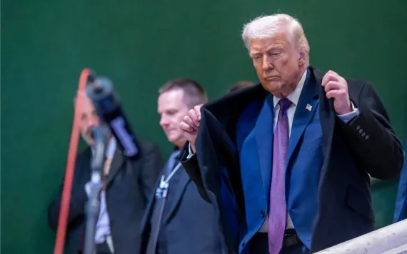 President Donald Trump walks down stairs during the Annual Meeting of the World Economic Forum, WEF, in Davos, Switzerland, Thursday, Jan. 22, 2026. (Laurent Gillieron/Keystone via AP)