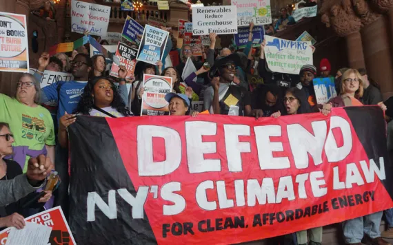 Organizers stand at the base of the million dollar staircase in the New York state capitol. 