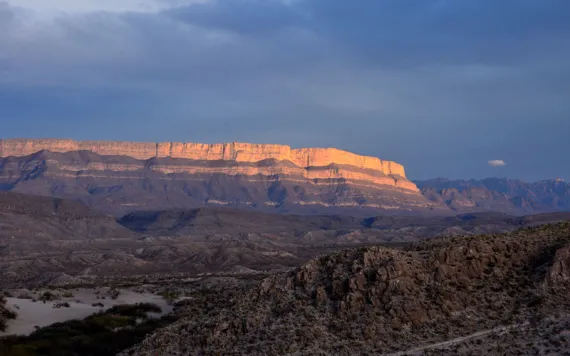 Sun setting over a cliff face in Big Bend National Park