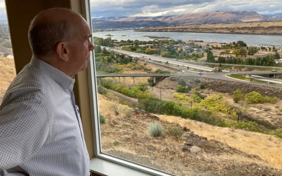 The Dalles Mayor Richard Mays looks at the view of his town and the Columbia River from his hilltop home in The Dalles, Ore. Residents of The Dalles should soon know how much of their water Google's data centers there have been using to cool the computers, after a lawsuit seeking to keep the information confidential was dropped.