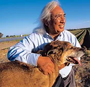 Harvard grad Hugo Morales, with his dog, Revolution, spent his childhood picking fruit on a farm. Now he works to keep pesticides from poisoning laborers, regardless of where they are from.