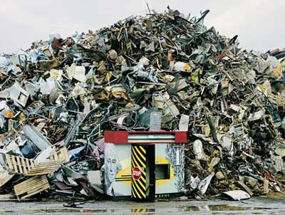 Photographer Chris Jordan captured a discarded cash machine and other scrap metal slated for shredding in his E-Bank, Tacoma 2004.