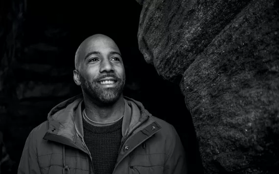 CJ Goulding smiles and looks off to the side