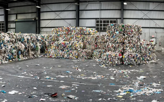 A warehouse with stacked bales of recycling in Brooklyn, New York.