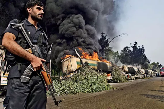 A fuel convoy bound to resupply NATO forces in Afghanistan burns after an attack by militants in Khyber Pakhtunkhwa Province, Pakistan.| ARSHAD ARBAB/EPA/Corbis