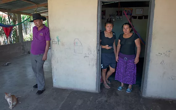 Roque Martinez Ramos's father, sister, and mother at their home in the Lower Aguan Valley, Honduras