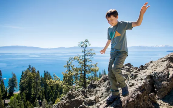 Robbie Bond, the founder of Kids Speak for Parks, plays near Lake Tahoe.