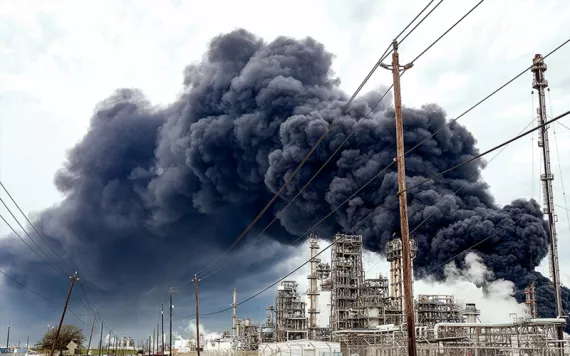 A large plume of black smoke rises into the sky from a fire at a petrochemical plant near Houston.