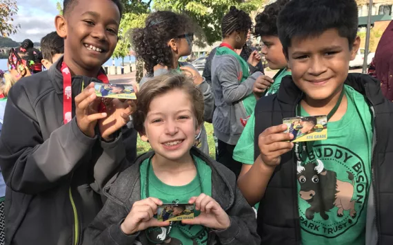 Three fourth graders with their Every Kid in a Park Passes.