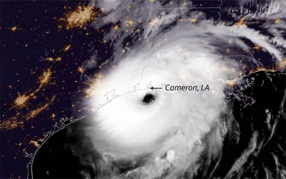 Hurricane Laura as seen from above is a massive swirl of white over Cameron, Louisiana.
