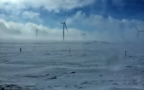 wind turbines in snowstorm
