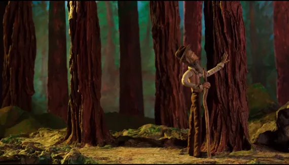 Tiny stop-motion John Muir admiring a tree trunk