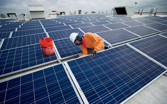 Ikea solar panels: Neil Black works on the installation of South Florida's largest solar panel array atop the future IKEA store in Miami, Wednesday, April 16, 2014. This is Ikea's 40th solar powered project in the U.S. The 178,000 square foot solar array 
