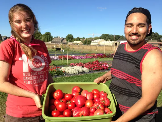 Oregon State University students Annie and Nazario, at work in one of OSU's many student- and volunteer-managed gardens. 