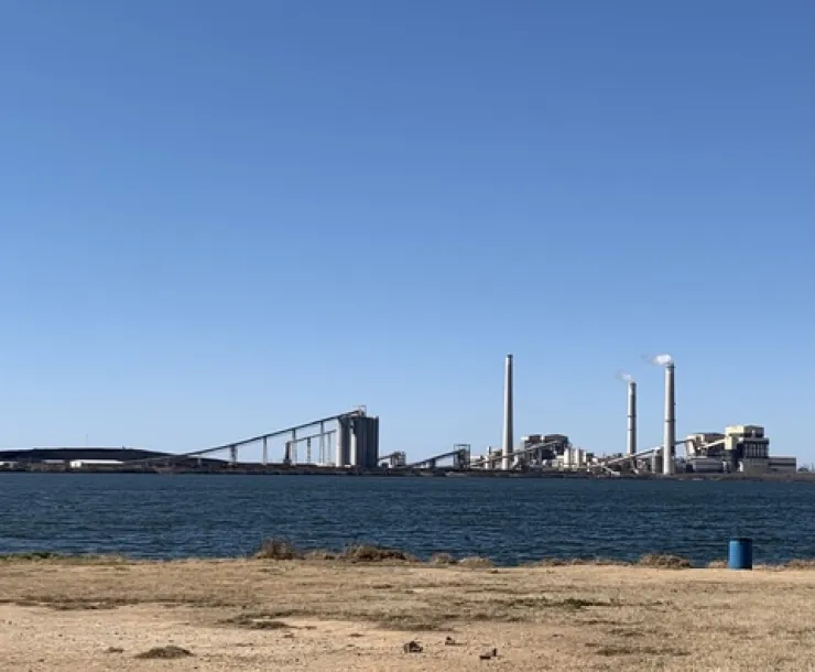 The Spruce coal plant sits behind Calaveras Lake in San Antonio.