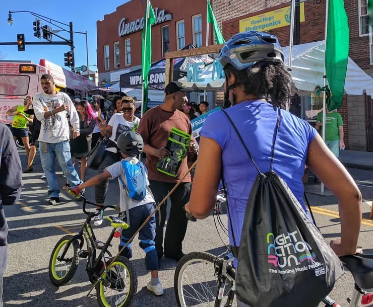 People walking with bikes in Anacostia, DC