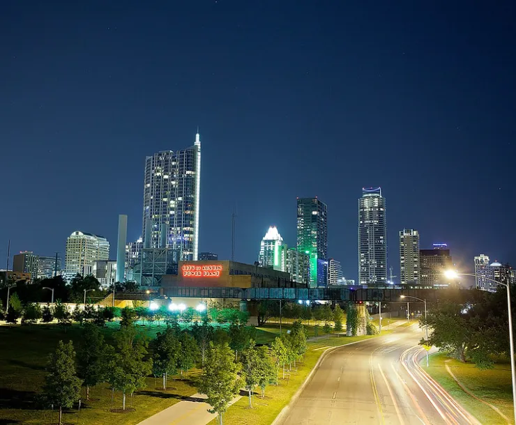 The Austin skyline at night, with City of Austin power plant in forefront.