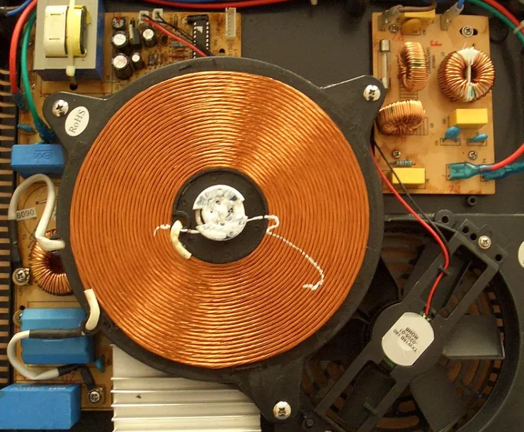 An induction cooking electromagnet https://commons.org/wiki/File:Induktionskochfeld_Spule.jpg