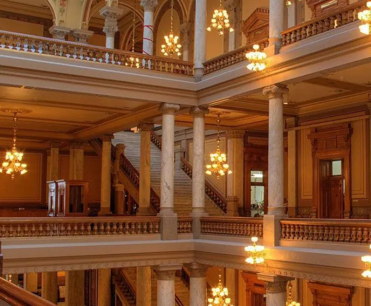 An interior shot of the Indiana statehouse halls, showing tall columns