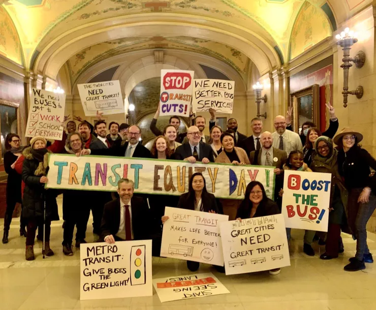 Testifiers, transit and climate experts, union bus drivers, Transportation Forward coalition partners, and Minnesota House members gather outside a State Capitol hearing room for Transit Equity Day. Photo: Move Minnesota