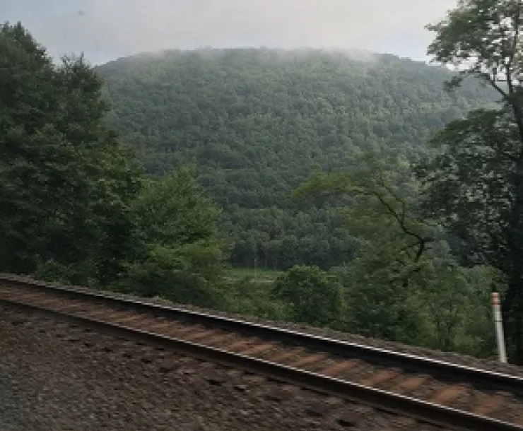 View of Appalachians and railroad track from an Amtrak train, 2019