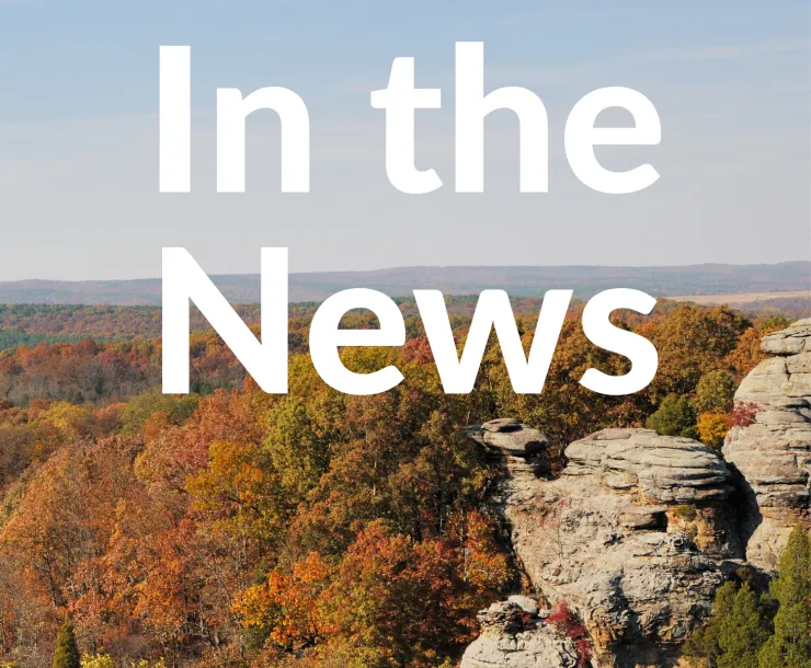 A photo of the Garden of the Gods includes white text that reads, "In the News."