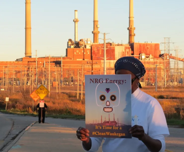 Activist rallies for coal plant cleanup in Waukegan.