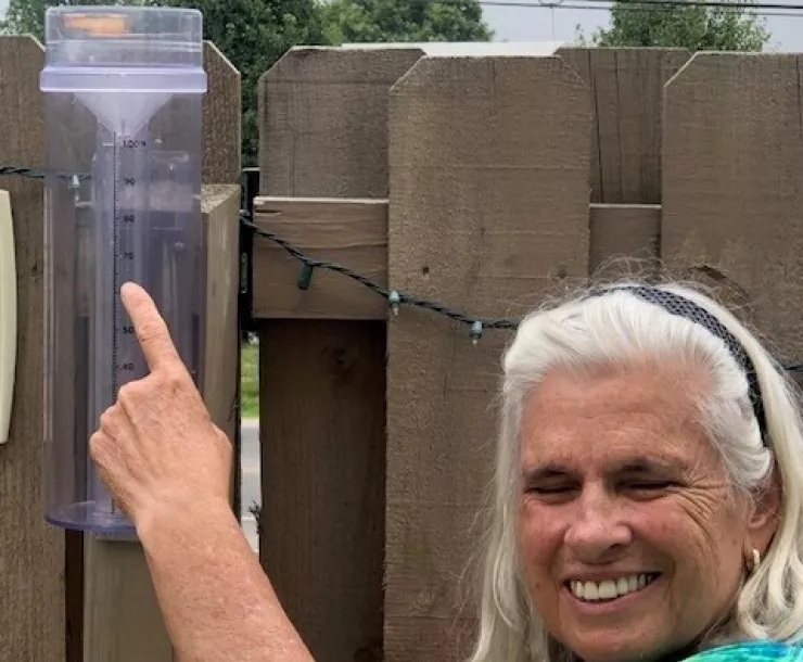 Joanne Logan and her raingauge