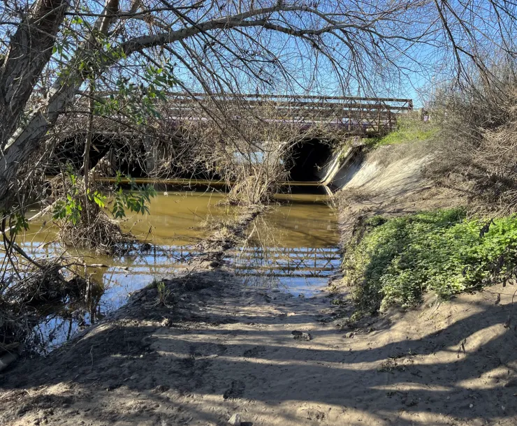 Palo Alto Baylands underpass flooded with water over a walking path during the King Tide.