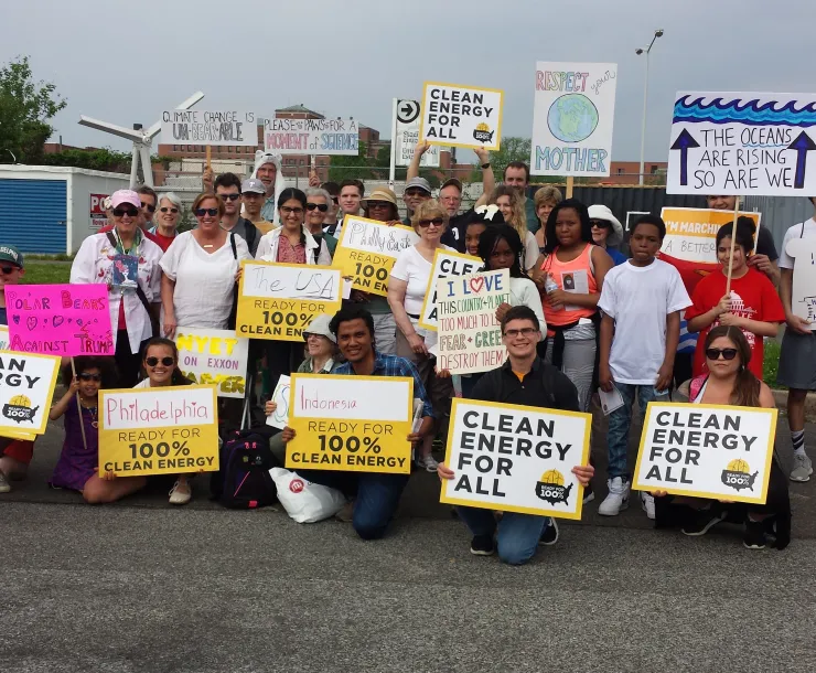 Group of demonstrators with RF100 signs