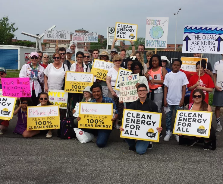 Group of demonstrators with RF100 signs