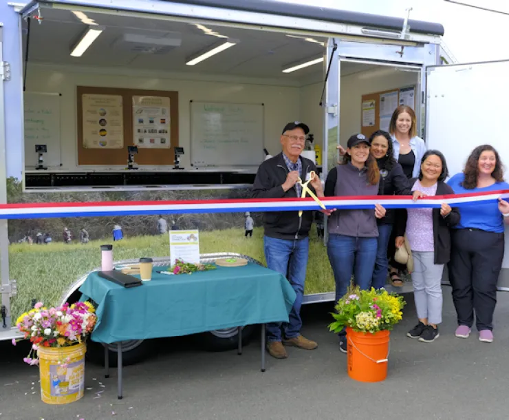 Ribbon cutting ceremony for Outdoor Connection in Amcan