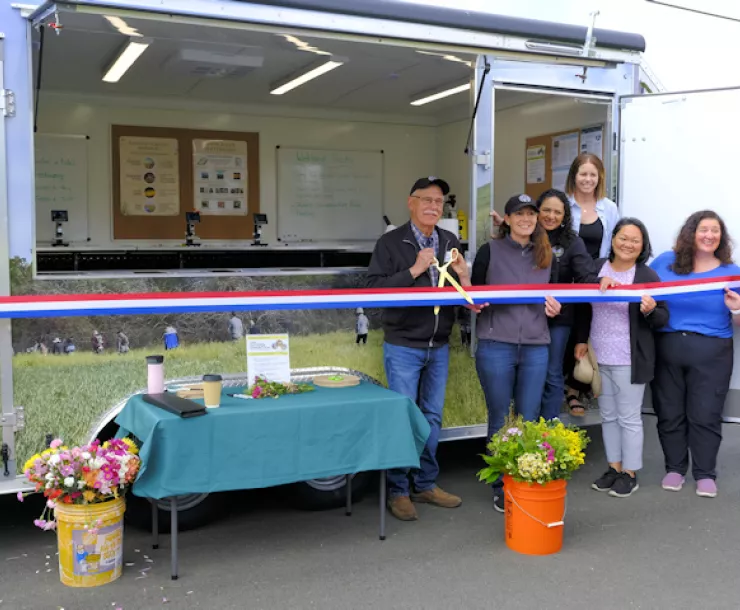 Ribbon cutting ceremony for Outdoor Connection in Amcan