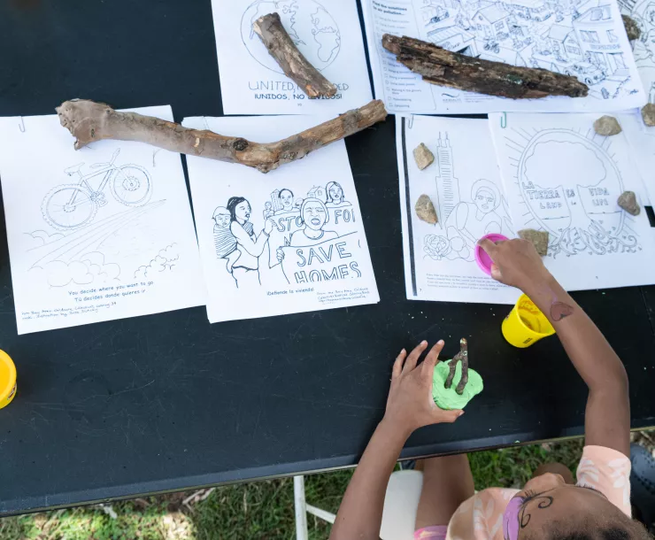 A child does crafts at the event
