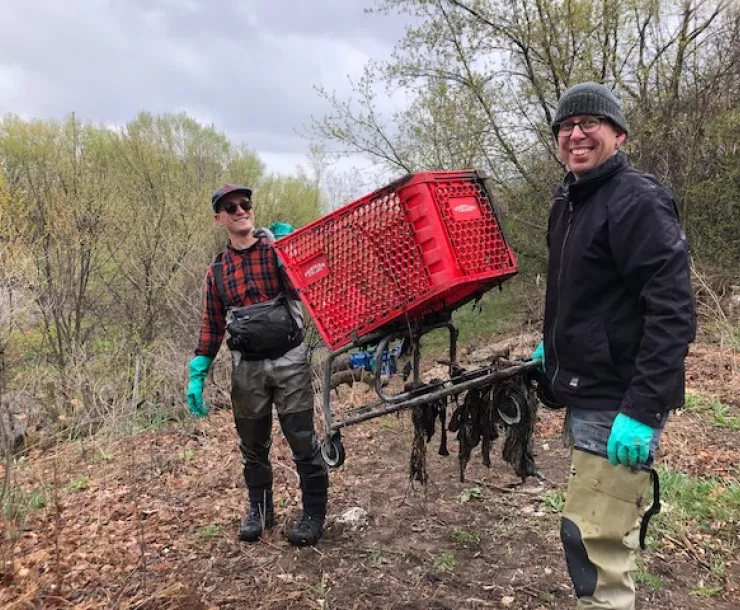 Volunteers remove shopping cart 