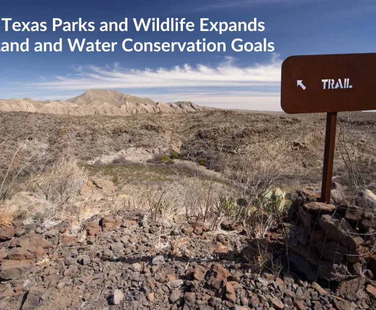 Up on a scraggly ridge a metal sign reads "TRAIL" with an arrow pointing upward and to the left. Text: Texas Parks and Wildlife Expands Land and Water Conservation Goals