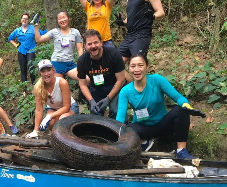 Volunteers clean up the French Broad River. Photo courtesy of Asheville Greenworks