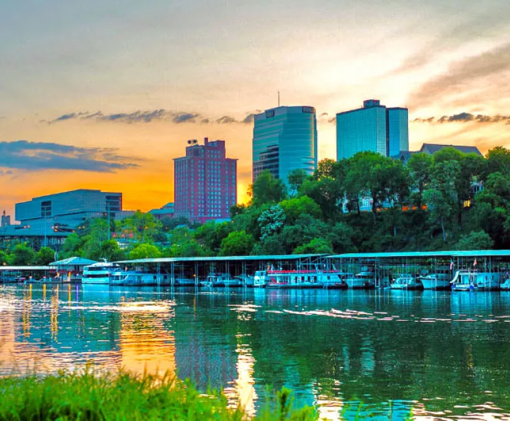 Knoxville skyline reflected in river at dusk