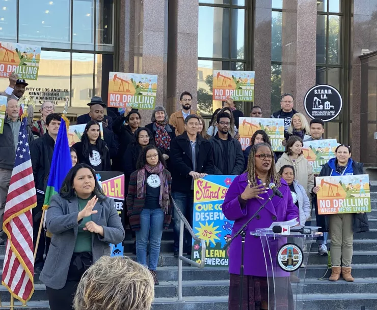 Group of people protesting oil drilling in LA county