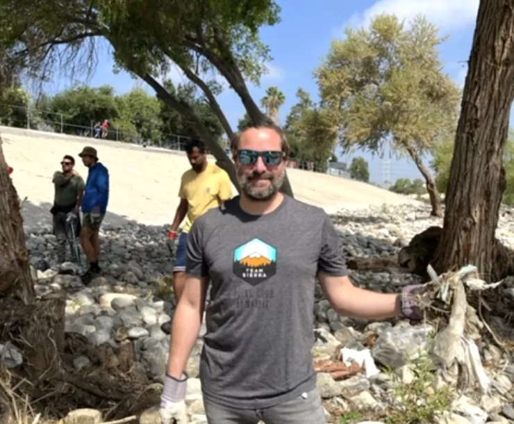 Mathieu picking up trash (wearing gloves!)