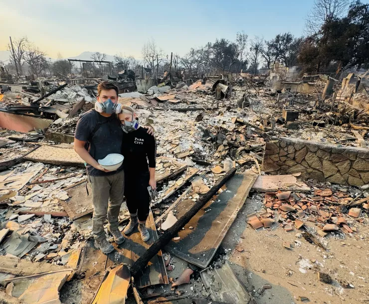 Megan Mantia stands in the ruins of her home