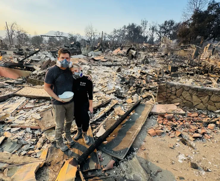 Megan Mantia stands in the ruins of her home
