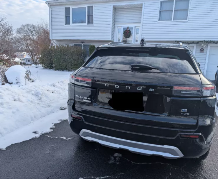 Electric vehicle (EV) in front of a home
