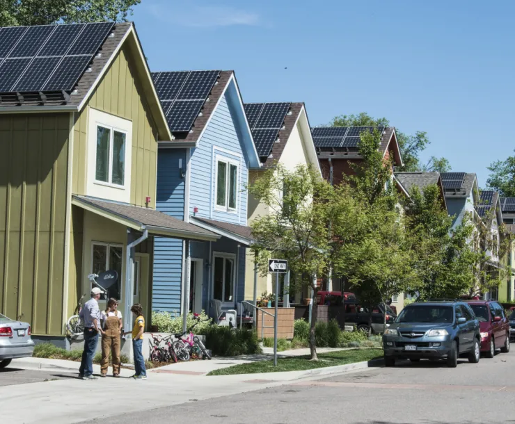 row of houses with solar panels